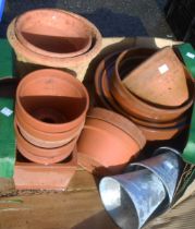 A box containing a quantity of assorted terracotta plant pots