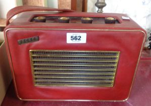 A vintage Hacker portable transistor radio with turntable base