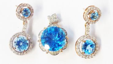 A 9ct. gold pendant and pair of drop earrings, all set with circular Swiss blue topaz stones