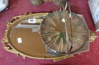 A vintage brass framed mirror - sold with two silver plated dishes