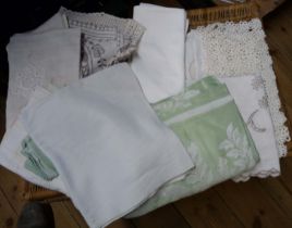 A bag containing a small quantity of table linen including tray cloths, tablecloths, etc.