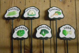A set of six modern painted iron vegetable labels