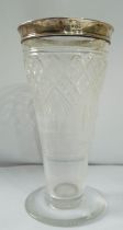 A 15cm cut glass vase with silver rim