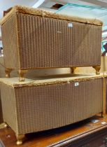 Two vintage Lloyd Loom ottoman linen chests both with original labels and gold sprayed finish, the