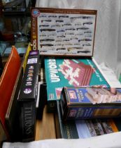 A box containing a quantity of assorted board games, jigsaws, etc. including Tumbling Tower,