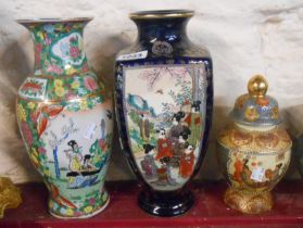 A Japanese late Satsuma vase of four sided form, the panels decorated with hand painted figures