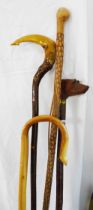 Four modern handmade walking sticks including carved wood dog's head handled, shepherds crook