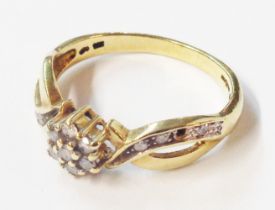 An import marked 375 (9ct.) gold ring, set with tiny diamonds - one missing - size P