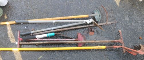 A quantity of assorted long handled garden tools