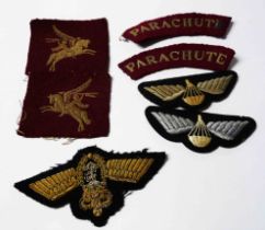 A bag containing a quantity of WWII uniform patches for Parachute and other Regiments