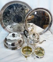A quantity of silver plated items comprising three piece tea set, two circular trays and a large