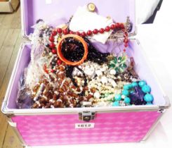 A vanity flight case containing a large quantity of assorted costume jewellery
