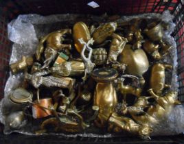 A crate containing a large quantity of brass figurines and other items including frogs, elephant,