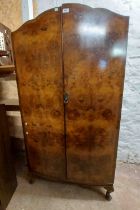 A 92cm vintage figured walnut veneered wardrobe with hanging space and drawers enclosed by a pair of
