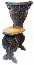 A 19th Century ornate carved oak Renaissance Revival carved oak chair with profuse decoration and