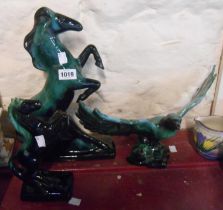 Three pieces of Blue Mountain Pottery Canada figurines comprising a large rearing horse, a smaller