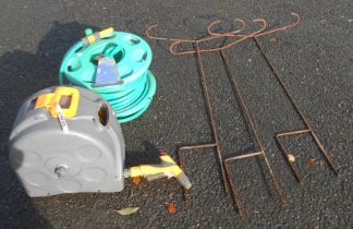 A Hozelock garden hose reel - sold with another similar and three metal garden supports