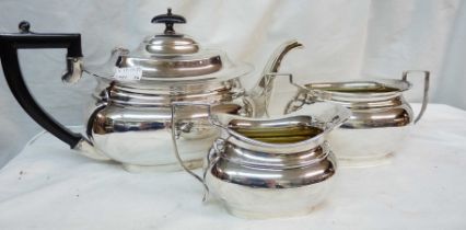 An English silver plated three piece tea set of bulbous oval form