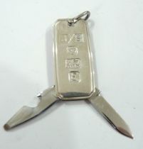 A silver novelty ingot style folding knife and bottle opener - Sheffield 1979