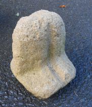 A small worked sandstone doorstop