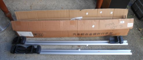 A boxed pair of universal roof bars