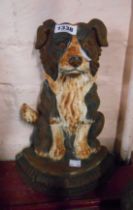 A modern painted cast iron door stop of collie dog form