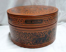 An Oriental red lacquer decorated circular box - marked to lid MG.SAING