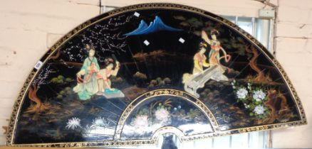 A large vintage Japanese lacquered wooden wall plaque with of fan form with applied and painted