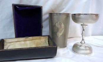 A cased communion set comprising large beaker and double ended chalice with engraved initials - case