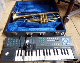 A Chinese Skylark trumpet, in fitted carry case - sold with a Yamaha Portasound PSS-140 keyboard