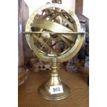 A modern brass astrological style globe