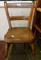 A late Victorian child's chair with solid moulded elm seat, set on ring turned supports - stamped 'S