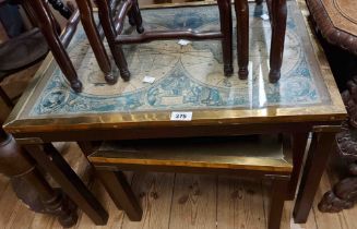A nest of three campaign style brass bound stained wood tea tables, all with reproduction map prints