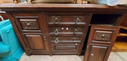 A 1.54m late Victorian walnut sideboard with three central drawers and cupboard flanked by further