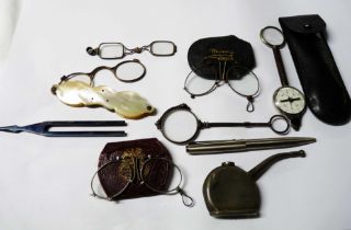 A bag containing a quantity of collectable items including four vintage lorgnettes, a cased compass,