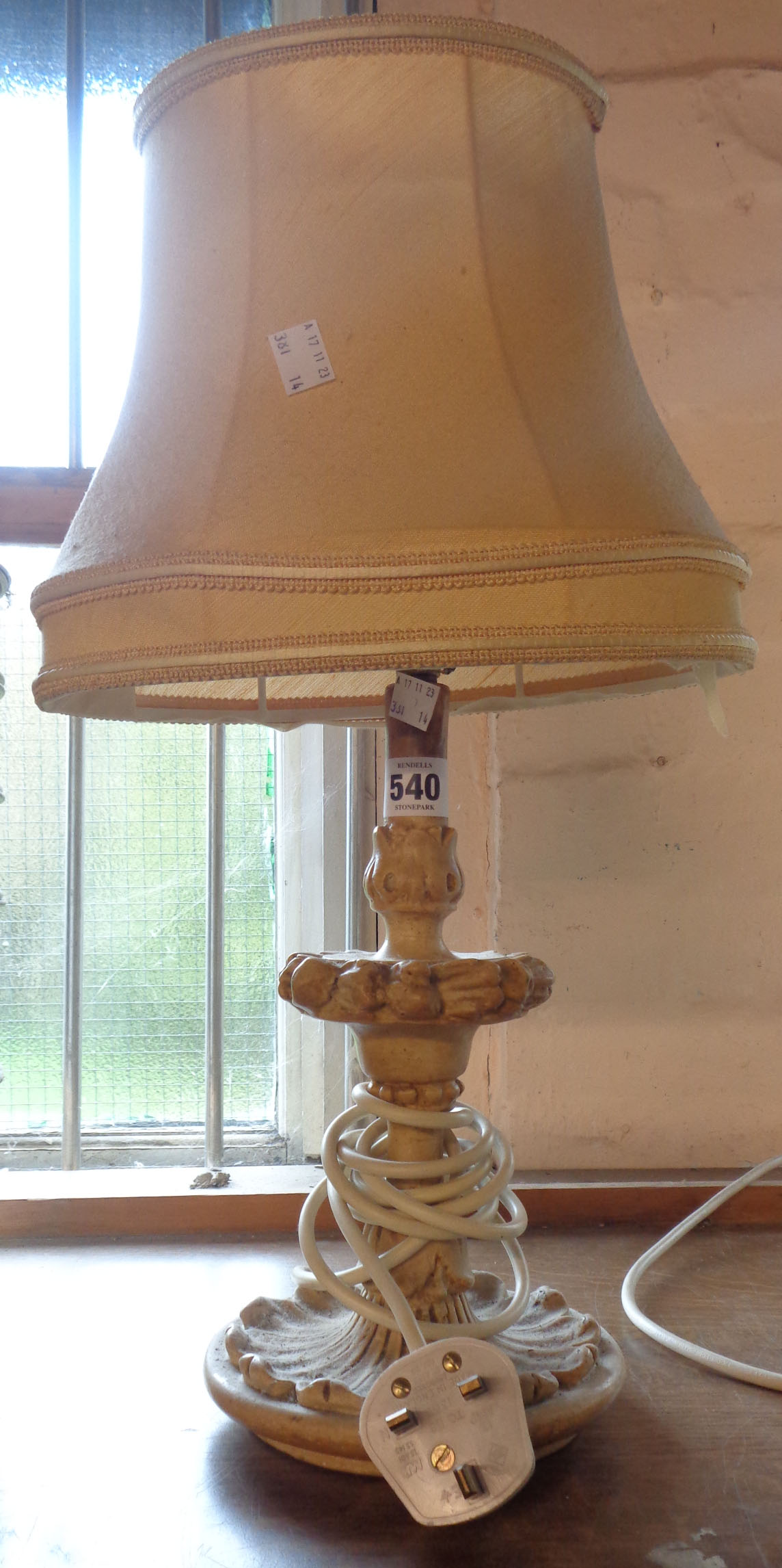 A vintage plaster table lamp and shade