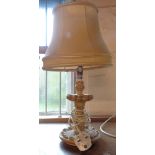 A vintage plaster table lamp and shade