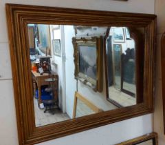 A gilt framed oblong wall mirror