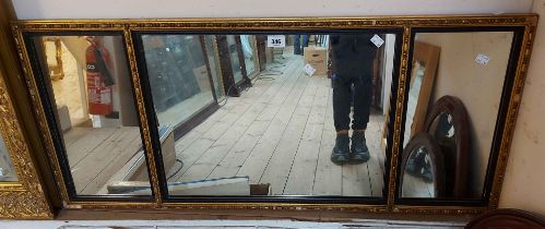 A 1.1m vintage gilt and ebonised lined framed triple plate wall mirror - minor loss