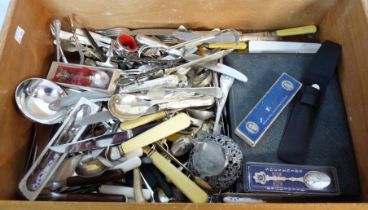 A crate containing a quantity of assorted silver plated and other cutlery