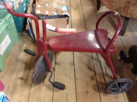A vintage painted metal child's tricycle