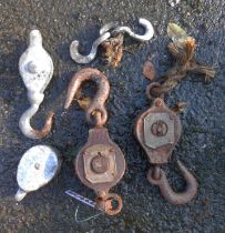 A quantity of old pulleys
