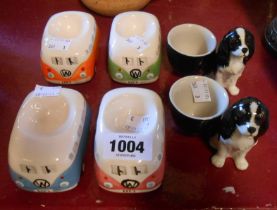 A set of four Volkswagen camper van form egg cups - sold with two Spaniel pattern examples