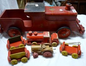 A large vintage wooden Tri-ang child's pull-along train toy with red painted finish - sold with a
