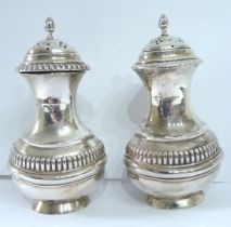 A pair of Chester silver pepperettes of oval baluster form - 1902/03