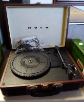 A modern portable Bush record player of suitcase form, with power lead