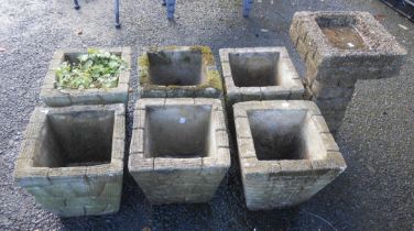 Six similar concrete planters of square tapered form - sold with a small concrete birdbath