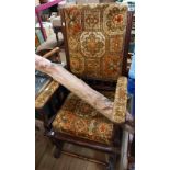 An early 20th Century mahogany show frame American rocking chair with studded tapestry upholstery