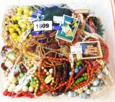 A bag containing a large quantity of mainly costume jewellery necklaces, etc.