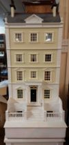 A very large five story Georgian town house style doll's house extensively furnished and with a